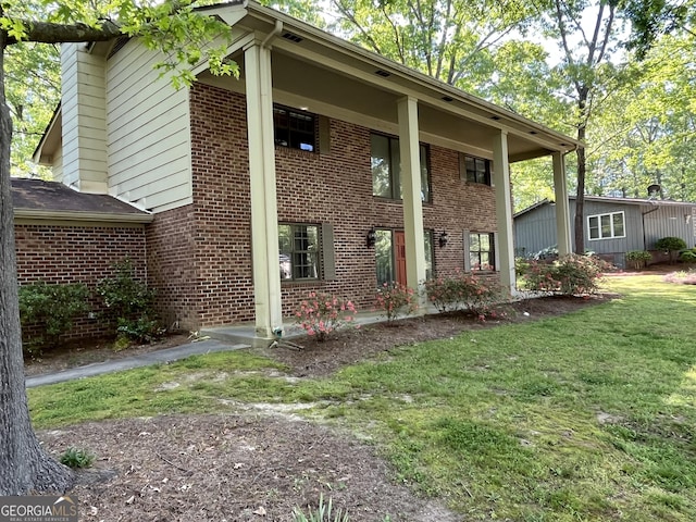 120 Treeside Dr NW, Rome, GA 30165 - exterior space with a front lawn and brick siding