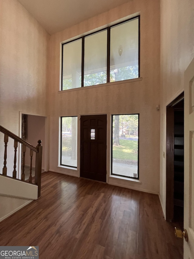 120 Treeside Dr NW, Rome, GA 30165 - foyer featuring baseboards, wood finished floors, a high ceiling, and stairs