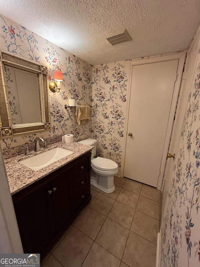 120 Treeside Dr NW, Rome, GA 30165 - bathroom featuring wallpapered walls, visible vents, tile patterned flooring, and vanity
