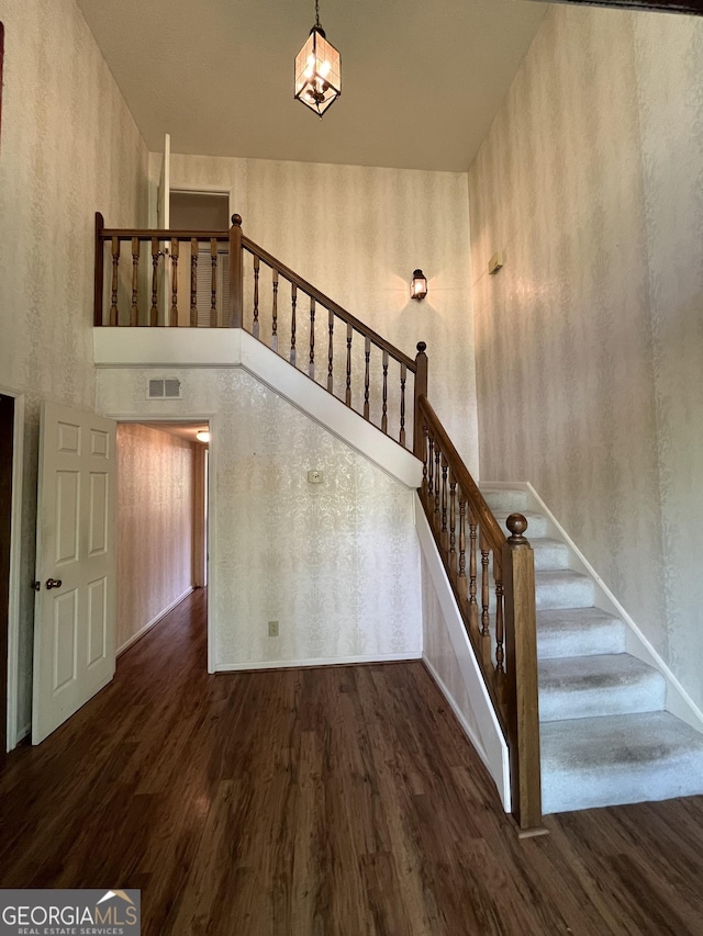 120 Treeside Dr NW, Rome, GA 30165 - staircase featuring visible vents, wallpapered walls, and wood finished floors