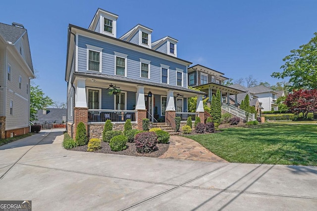 4256 Weaver St SE, Smyrna, GA 30080 - view of front of home with covered porch, a standing seam roof, and a front yard