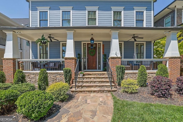 4256 Weaver St SE, Smyrna, GA 30080 - italianate-style house with a ceiling fan and a porch