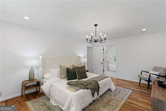 bedroom with a chandelier, baseboards, wood finished floors, and recessed lighting