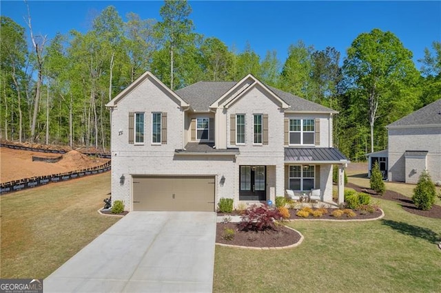 5003 Fairview Cir, Villa Rica, GA 30180 - view of front of home with driveway, covered porch, a front yard, a garage, and brick siding