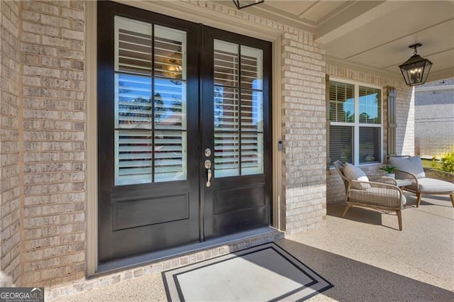 5003 Fairview Cir, Villa Rica, GA 30180 - property entrance featuring a porch, french doors, and brick siding