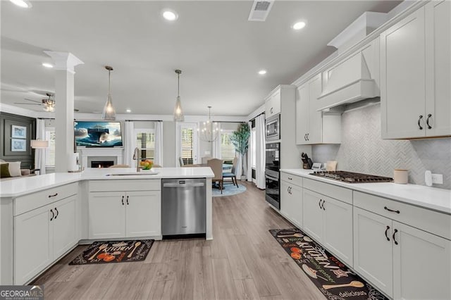 5003 Fairview Cir, Villa Rica, GA 30180 - kitchen with premium range hood, appliances with stainless steel finishes, a sink, and light countertops