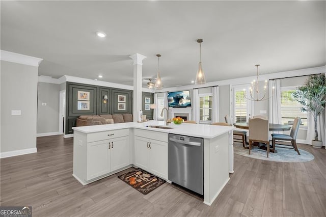 5003 Fairview Cir, Villa Rica, GA 30180 - kitchen featuring light countertops, stainless steel dishwasher, a sink, a chandelier, and open floor plan