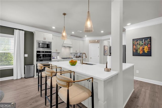 5003 Fairview Cir, Villa Rica, GA 30180 - kitchen with white cabinets, baseboards, a sink, and appliances with stainless steel finishes