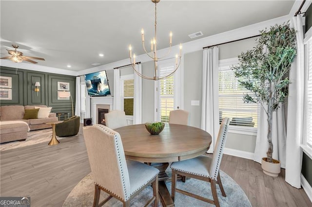 5003 Fairview Cir, Villa Rica, GA 30180 - dining space with light wood-type flooring, a fireplace, baseboards, visible vents, and recessed lighting