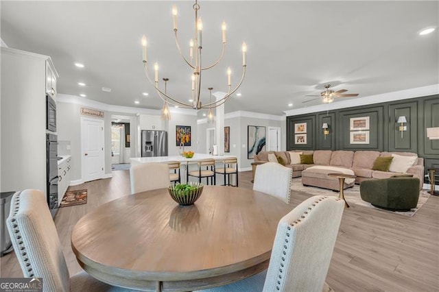 5003 Fairview Cir, Villa Rica, GA 30180 - dining space featuring light wood-type flooring, baseboards, recessed lighting, and crown molding