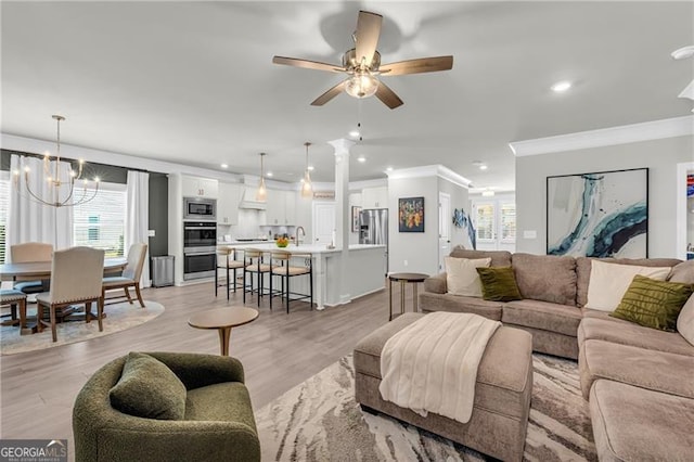 5003 Fairview Cir, Villa Rica, GA 30180 - living area featuring recessed lighting, ornamental molding, and ceiling fan with notable chandelier