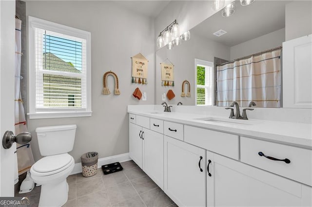5003 Fairview Cir, Villa Rica, GA 30180 - full bathroom with tile patterned floors, toilet, baseboards, and a sink