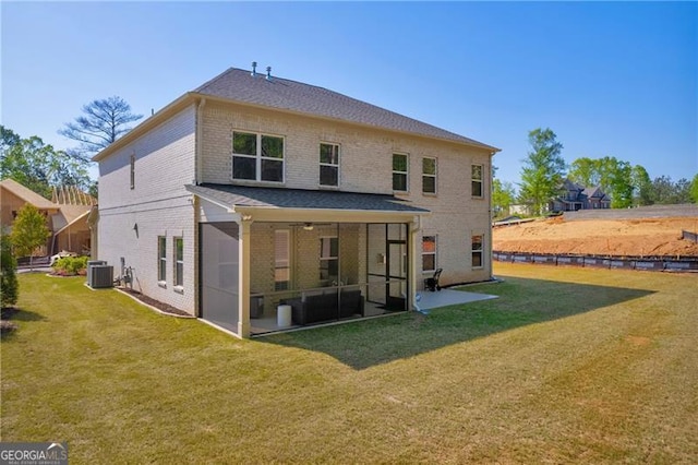 5003 Fairview Cir, Villa Rica, GA 30180 - rear view of house featuring brick siding, central air condition unit, a sunroom, and a lawn
