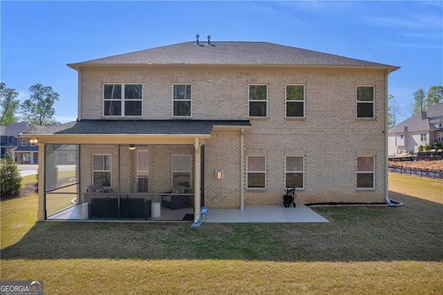5003 Fairview Cir, Villa Rica, GA 30180 - back of house featuring a lawn, a sunroom, a patio, and brick siding