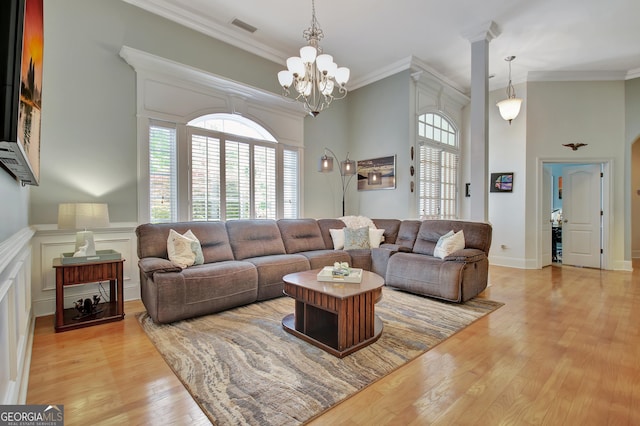 135 Adams Park Dr, Fayetteville, GA 30214 - living area featuring light wood-style floors, crown molding, and a chandelier