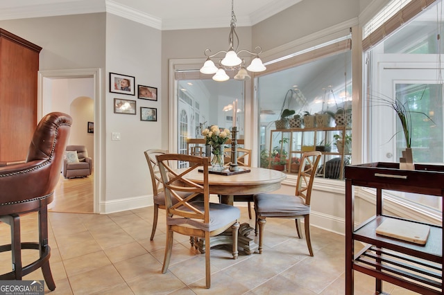 135 Adams Park Dr, Fayetteville, GA 30214 - dining area featuring baseboards, a chandelier, light tile patterned floors, and crown molding
