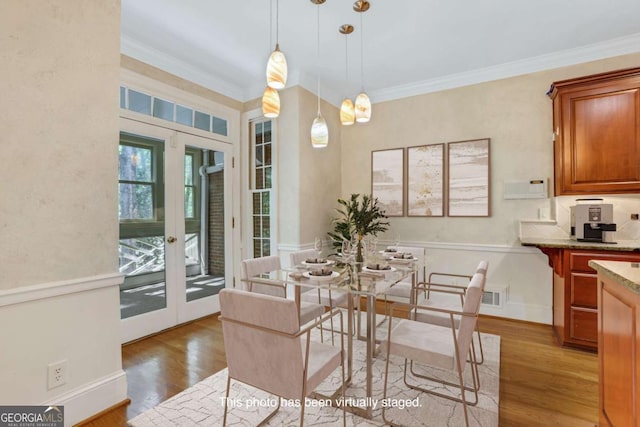 1020 Riverside Rd, Roswell, GA 30076 - dining area with visible vents, french doors, crown molding, and light wood-style flooring