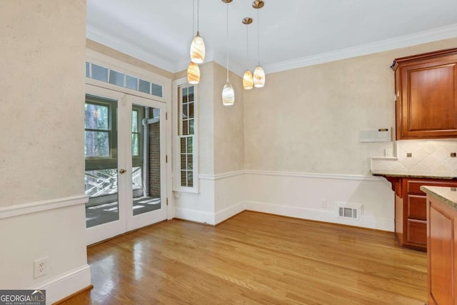 1020 Riverside Rd, Roswell, GA 30076 - unfurnished dining area featuring ornamental molding, light wood finished floors, visible vents, and french doors