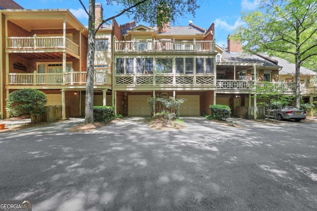 1020 Riverside Rd, Roswell, GA 30076 - view of building exterior featuring aphalt driveway and an attached garage
