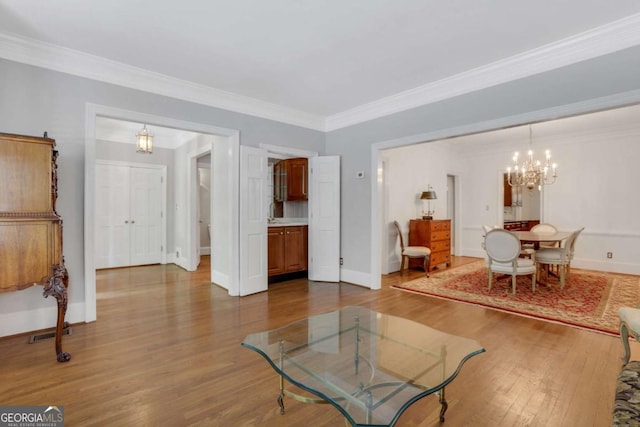 1020 Riverside Rd, Roswell, GA 30076 - living area with a chandelier, ornamental molding, dark wood-style floors, and baseboards