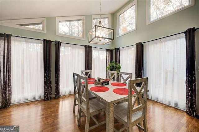 70 Denny Ridge Rd, Jasper, GA 30143 - dining room with wood finished floors, a chandelier, and a towering ceiling