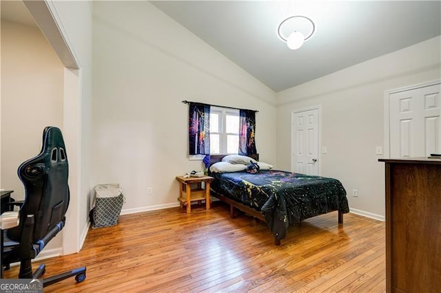 70 Denny Ridge Rd, Jasper, GA 30143 - bedroom with vaulted ceiling, light wood-style floors, and baseboards