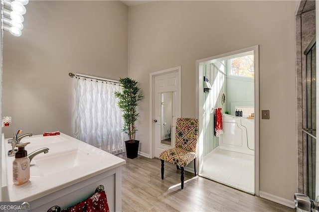 70 Denny Ridge Rd, Jasper, GA 30143 - full bathroom with baseboards, wood finished floors, a high ceiling, and vanity