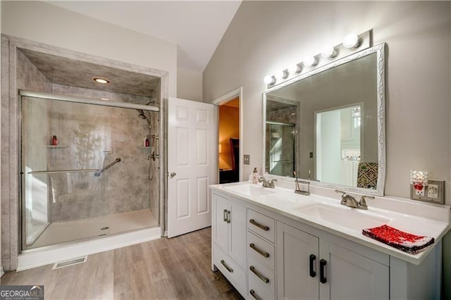 70 Denny Ridge Rd, Jasper, GA 30143 - bathroom with vaulted ceiling, double vanity, a stall shower, and a sink