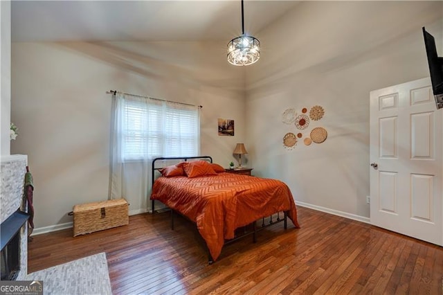 70 Denny Ridge Rd, Jasper, GA 30143 - bedroom featuring lofted ceiling, hardwood / wood-style flooring, baseboards, and a fireplace