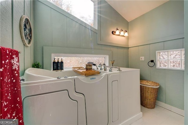 70 Denny Ridge Rd, Jasper, GA 30143 - bathroom with vaulted ceiling, tile patterned flooring, and a tub