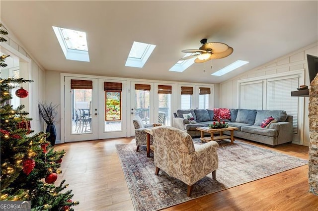 70 Denny Ridge Rd, Jasper, GA 30143 - living room with vaulted ceiling with skylight, wood finished floors, and french doors