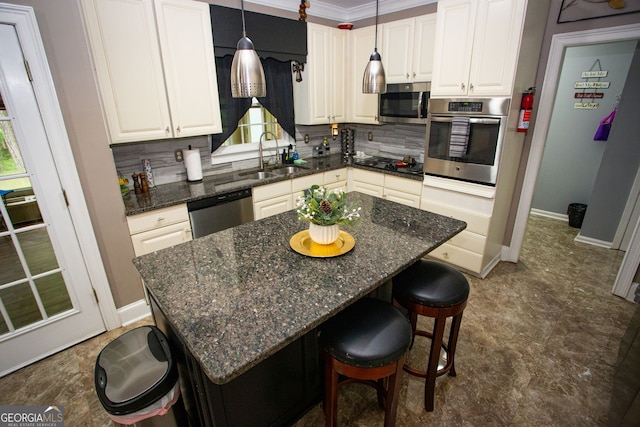 6147 Pritchett Dr, Powder Springs, GA 30127 - kitchen with stainless steel appliances, a sink, a kitchen breakfast bar, white cabinetry, and crown molding