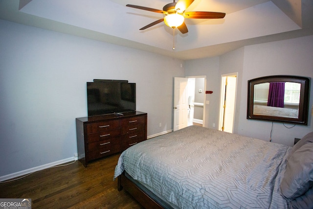 6147 Pritchett Dr, Powder Springs, GA 30127 - bedroom with dark wood-style floors, baseboards, and ceiling fan