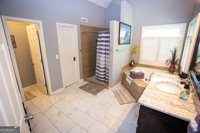 6147 Pritchett Dr, Powder Springs, GA 30127 - full bathroom featuring marble finish flooring, a stall shower, a garden tub, and baseboards