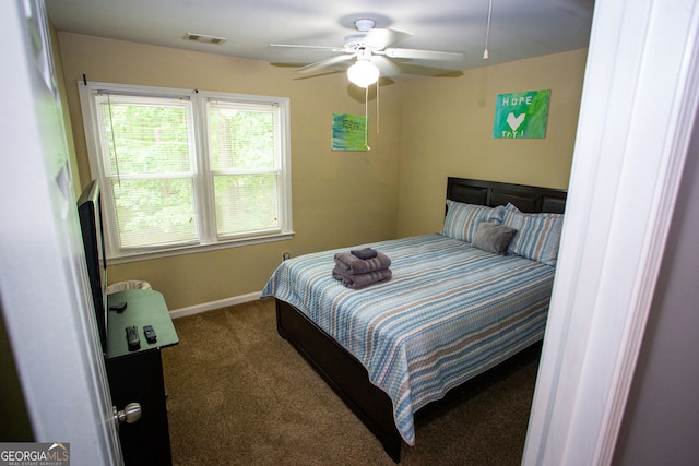 6147 Pritchett Dr, Powder Springs, GA 30127 - carpeted bedroom featuring baseboards and a ceiling fan