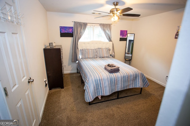 6147 Pritchett Dr, Powder Springs, GA 30127 - carpeted bedroom with baseboards and a ceiling fan