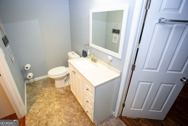 6147 Pritchett Dr, Powder Springs, GA 30127 - half bath with vanity, toilet, and baseboards