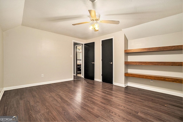 unfurnished bedroom with lofted ceiling, baseboards, a ceiling fan, and wood finished floors