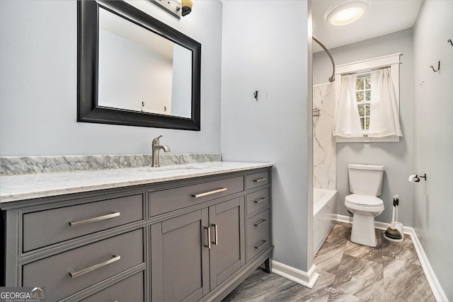 full bathroom featuring toilet, baseboards, marble finish floor, vanity, and shower / tub combination