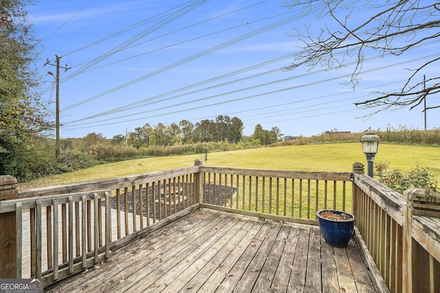 deck featuring a lawn