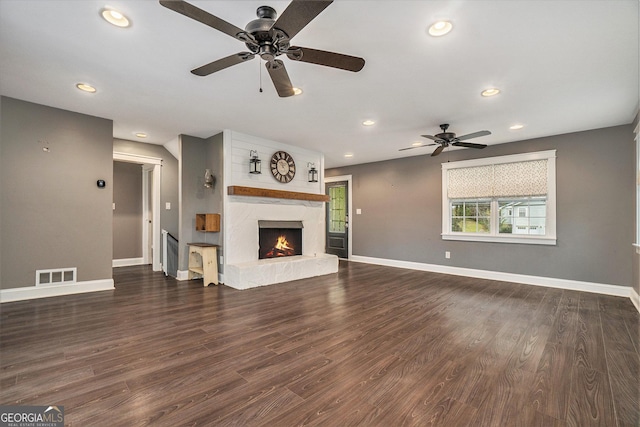 unfurnished living room with baseboards, visible vents, recessed lighting, a premium fireplace, and a ceiling fan