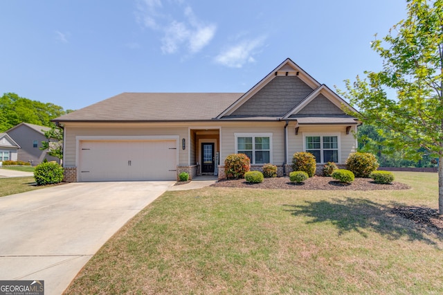 craftsman-style home featuring a garage, a front lawn, and concrete driveway