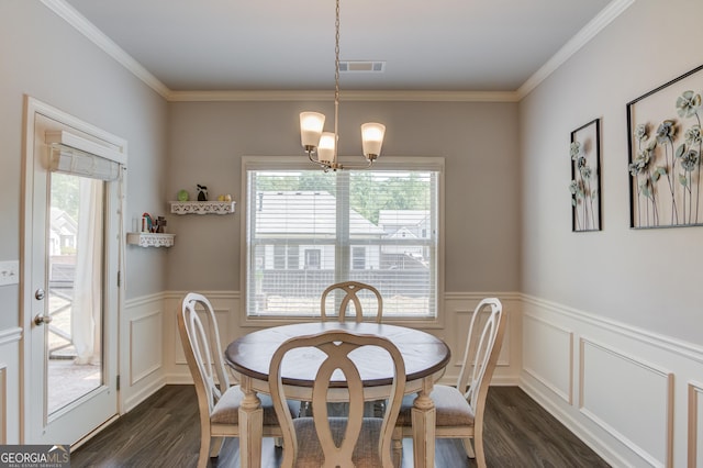 dining room featuring visible vents, dark wood-style flooring, and a healthy amount of sunlight