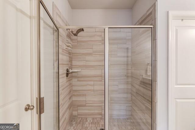 bathroom with a shower stall