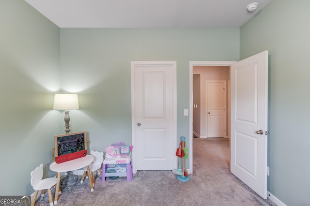 game room featuring carpet floors and baseboards