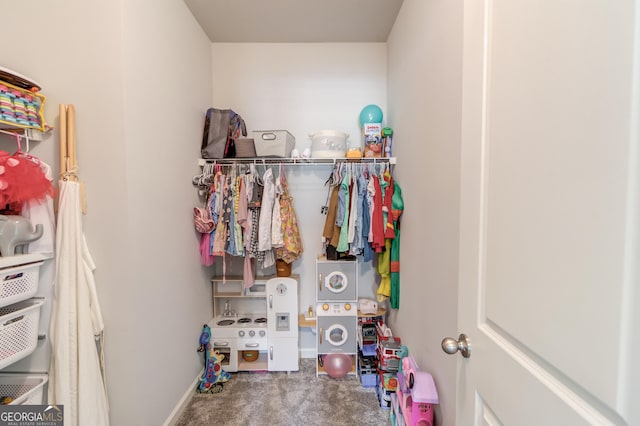 walk in closet featuring carpet
