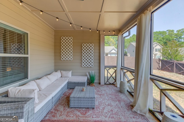 sunroom featuring an outdoor living space