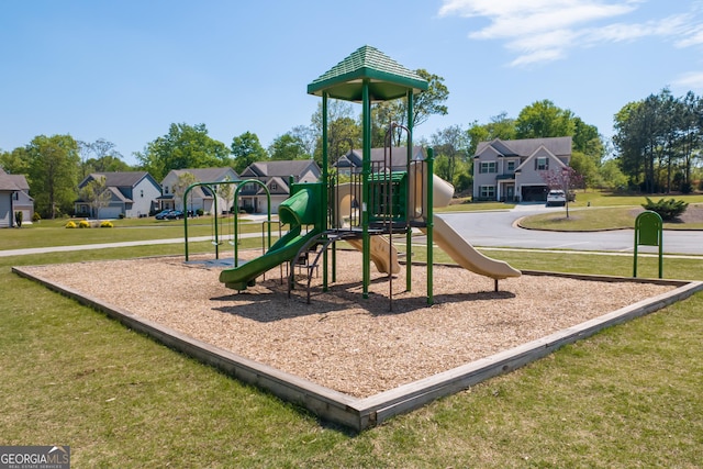 community jungle gym featuring a residential view and a yard