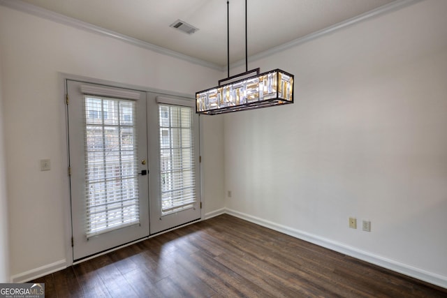 unfurnished dining area with visible vents, crown molding, dark wood-style flooring, and french doors