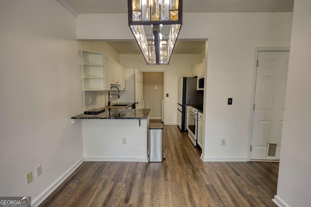 kitchen with dark wood finished floors, an inviting chandelier, open shelves, and a sink
